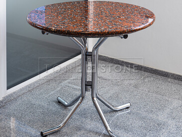 Kruhový stůl z Kapustinské žuly. Zakázkové kamenictví TONE OF STONE.