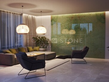 Obložení krbu a stěn technikou bookmatch přírodním kvarcitem Jadore.