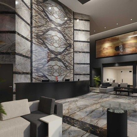 Inspirace - obklad recepce hotelu technikou bookmatch přírodním kamenem Eldorado.